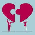 Teamwork concept design.Male and businesswoman lift heart-shaped puzzle symbols.